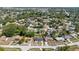 Expansive aerial view of a residential neighborhood with mature trees and well-maintained streets at 1432 Findlay St, Deltona, FL 32725