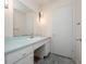 Bathroom with vintage-style vanity, sink, and a large mirror with decorative sconces at 1432 Findlay St, Deltona, FL 32725