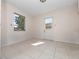 Bright bedroom featuring neutral walls, tile flooring and a door to the exterior at 1432 Findlay St, Deltona, FL 32725