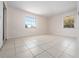 Bright, spacious bedroom with tile flooring and natural light from two large windows at 1432 Findlay St, Deltona, FL 32725