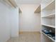 Walk-in closet featuring built-in shelves and a hanging rod for optimal storage at 1432 Findlay St, Deltona, FL 32725