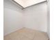 A simple closet space with tile flooring and a single hanging rod at 1432 Findlay St, Deltona, FL 32725