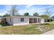 A charming single-story home features a combination of brick and stucco with an attached garage at 1432 Findlay St, Deltona, FL 32725