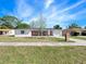 Traditional single-story home with brick accents, attached garage, and a well-kept front lawn at 1432 Findlay St, Deltona, FL 32725