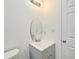 Bathroom featuring a gray vanity with an oval mirror and chrome lighting at 1502 W 16 Th Street, Sanford, FL 32771