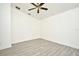A bright bedroom features modern gray flooring and white walls and trim, with a ceiling fan at 1502 W 16 Th Street, Sanford, FL 32771