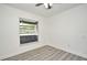 Bright bedroom with window overlooking screened-in porch at 1502 W 16 Th Street, Sanford, FL 32771