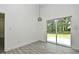 Dining room with sliding glass door to back patio and modern hanging light fixture at 1502 W 16 Th Street, Sanford, FL 32771