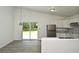 Open-concept kitchen with stainless appliances and sliding door to back yard at 1502 W 16 Th Street, Sanford, FL 32771