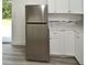 Modern kitchen with stainless steel refrigerator and granite countertops at 1502 W 16 Th Street, Sanford, FL 32771