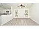 A large, open-concept living room features lots of natural light and a modern floor at 1502 W 16 Th Street, Sanford, FL 32771