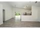 Open-concept living space with kitchen and access to back patio at 1502 W 16 Th Street, Sanford, FL 32771