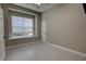 Well-lit bedroom featuring modern flooring, a large window, and a neutral paint color at 1528 Langham Ter, Lake Mary, FL 32746