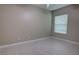 Bright bedroom with white wood-look floors, a ceiling fan, and a window for plenty of natural light at 1528 Langham Ter, Lake Mary, FL 32746