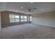 Large bonus room with recessed lights, neutral carpet, and large windows overlooking trees at 1528 Langham Ter, Lake Mary, FL 32746