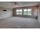 Spacious bonus room with plush neutral carpeting, recessed lighting, and large bright windows at 1528 Langham Ter, Lake Mary, FL 32746