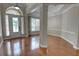 Inviting foyer with elegant hardwood floors, wainscoting and large window to allow for natural light at 1528 Langham Ter, Lake Mary, FL 32746