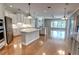 Spacious kitchen with white cabinetry, a large center island, and stainless steel appliances at 1528 Langham Ter, Lake Mary, FL 32746