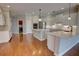 Bright kitchen featuring white cabinetry, stainless steel appliances, double islands, and hardwood floors at 1528 Langham Ter, Lake Mary, FL 32746