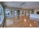 Open floor plan with wood floors and large sliding doors with views of the back porch and pool at 1528 Langham Ter, Lake Mary, FL 32746
