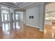 Beautiful entryway and living room with hardwood floors, molding and direct access to kitchen at 1528 Langham Ter, Lake Mary, FL 32746