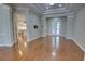 Open floor plan features hardwood floors, crown molding and french doors for indoor/outdoor living at 1528 Langham Ter, Lake Mary, FL 32746