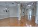 Bright living room with gleaming hardwood floors, recessed lighting, and elegant architectural details at 1528 Langham Ter, Lake Mary, FL 32746