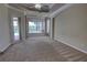 Main bedroom featuring carpeted floors, backyard views and access to the patio/pool at 1528 Langham Ter, Lake Mary, FL 32746