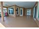 Covered patio area with tan flooring and paint plus access to the pool area at 1528 Langham Ter, Lake Mary, FL 32746