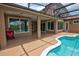 Spacious covered patio with access to pool, perfect for outdoor entertaining and lounging at 1528 Langham Ter, Lake Mary, FL 32746
