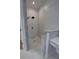 Updated main bathroom with a walk-in shower featuring granite accents and new fixtures at 1528 Langham Ter, Lake Mary, FL 32746
