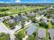 Beautiful aerial view of a neighborhood with lush green lawns and a golf course in the background at 1531 Tiverton Blvd, Winter Garden, FL 34787