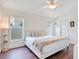 Bright bedroom with a ceiling fan and natural light from the windows at 1531 Tiverton Blvd, Winter Garden, FL 34787