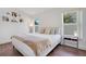 Bright bedroom featuring modern furnishings, two windows, and laminate wood flooring at 1531 Tiverton Blvd, Winter Garden, FL 34787