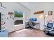 Bright bedroom with a large window, wood-look floors, and furnished with a gaming setup at 1531 Tiverton Blvd, Winter Garden, FL 34787