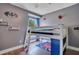 bedroom with loft bed, colorful accents and decor, and wood-look floors at 1531 Tiverton Blvd, Winter Garden, FL 34787