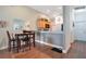 View of the dining area adjacent to the kitchen with wood floors and stylish decor at 1531 Tiverton Blvd, Winter Garden, FL 34787