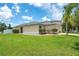 Home with a well-manicured lawn and landscaping and a two-car garage in a suburban neighborhood at 1531 Tiverton Blvd, Winter Garden, FL 34787