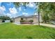Charming home with a two-car garage, landscaped front yard, and a beautiful palm tree at 1531 Tiverton Blvd, Winter Garden, FL 34787