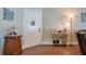 Inviting foyer with wood-look floors, coat closet, and a charming decorative display at 1531 Tiverton Blvd, Winter Garden, FL 34787