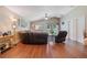 Open living room with wood floors, vaulted ceiling, comfortable seating, and natural light at 1531 Tiverton Blvd, Winter Garden, FL 34787