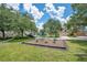 Neighborhood playground with balance beam equipment and green space at 1531 Tiverton Blvd, Winter Garden, FL 34787