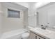 Neutral bathroom featuring a tub and shower at 1533 Ravana Dr, Orlando, FL 32822