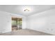 Bright bedroom with a sliding glass door leading to a screened patio, offering a seamless indoor-outdoor transition at 1533 Ravana Dr, Orlando, FL 32822