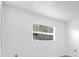 Neutral bedroom featuring a window with wood-look blinds at 1533 Ravana Dr, Orlando, FL 32822