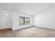 Bright living room features fresh paint and ample sunlight from large windows, perfect for relaxation at 1533 Ravana Dr, Orlando, FL 32822