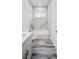 Bathroom features white tile backsplash, a tub, a toilet, and wood-look flooring at 15625 Sw 37Th Cir, Ocala, FL 34473