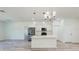 Bright kitchen with stainless steel appliances, white cabinetry, and an island with seating at 15625 Sw 37Th Cir, Ocala, FL 34473