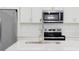 Close-up of a kitchen island featuring a stainless steel sink and modern appliances at 15625 Sw 37Th Cir, Ocala, FL 34473