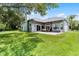 This home has a expansive backyard featuring lush lawn, mature trees and a covered patio at 1640 Wild Indigo Ter, Oviedo, FL 32766